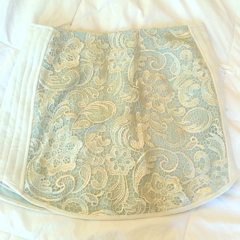 A classic lace overlay mini skirt